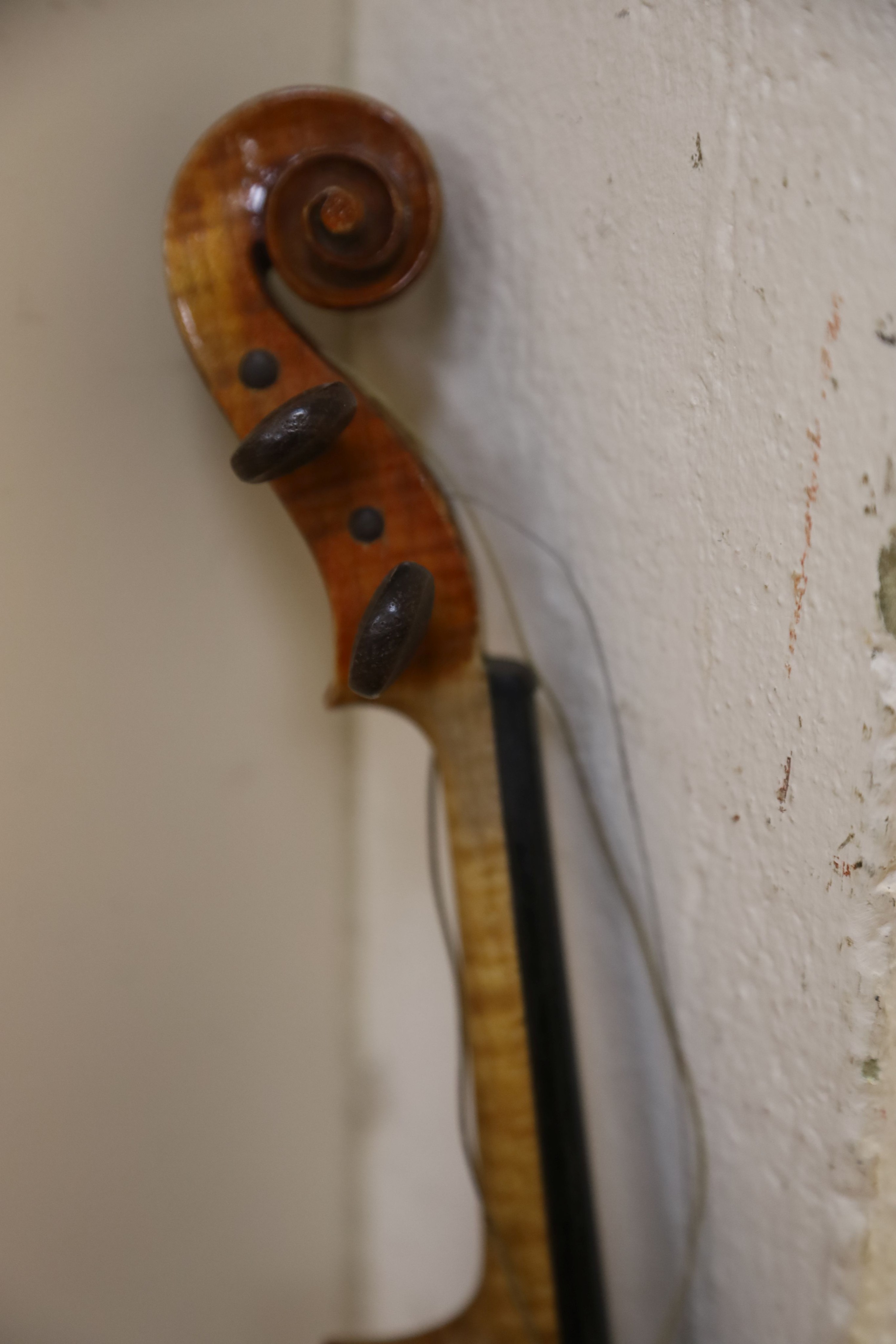 A Stradivarius copy violin and two bows and another bow, both cased, backs 33cm and 30cm